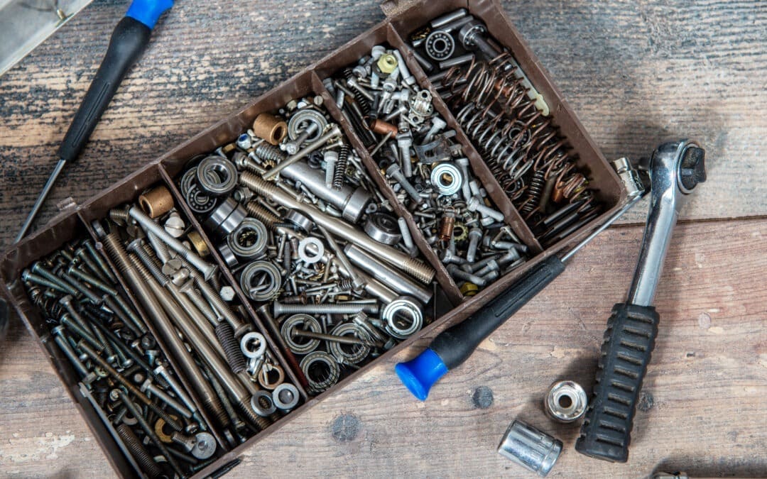 plastic toolbox with small screws and hardware materials